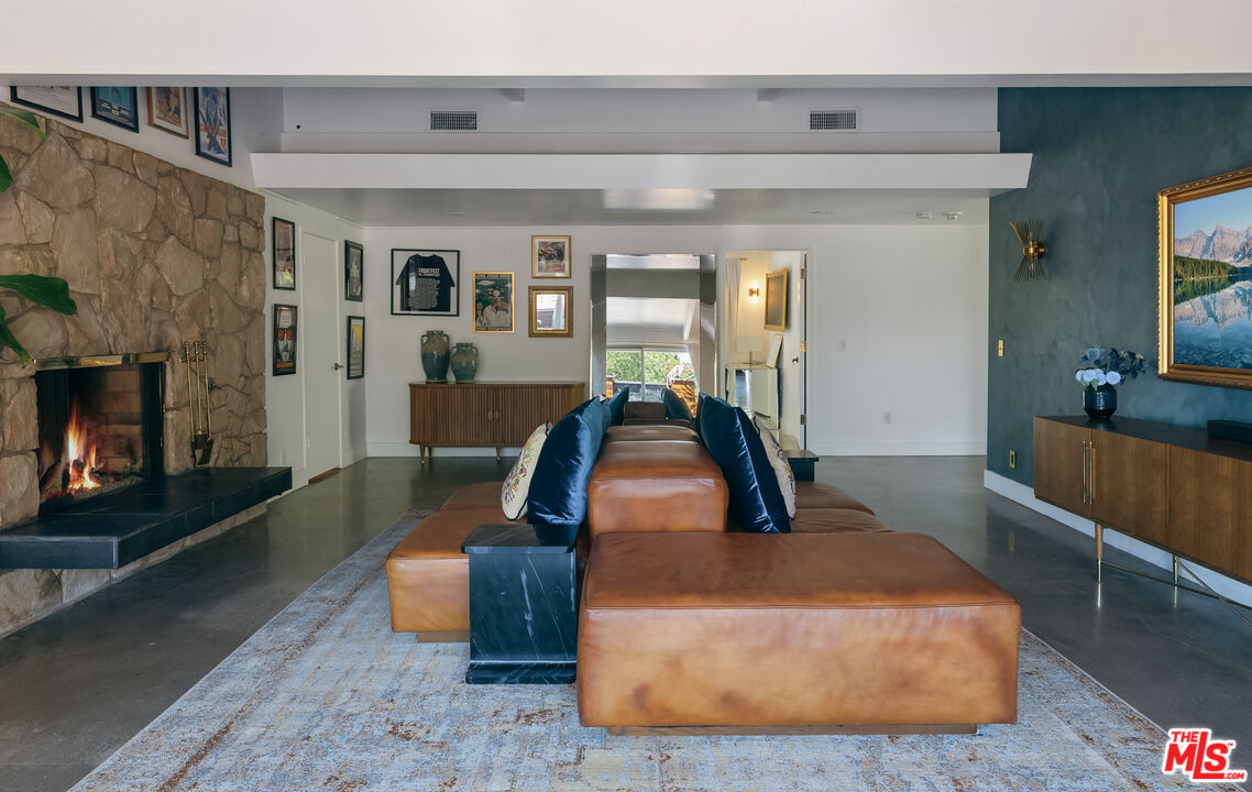 7211 Chelan Way Los Angeles, CA 90068 - Photo 6 of 38 a living room with furniture and a fireplace