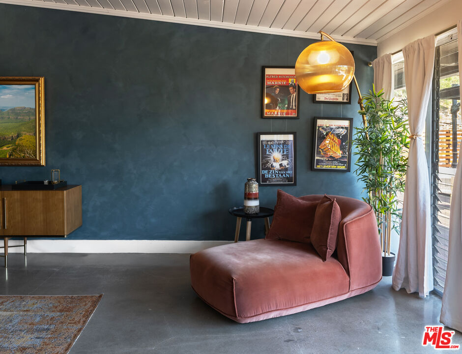 7211 Chelan Way Los Angeles, CA 90068 - Photo 7 of 38 a bedroom with a bed and a painting on the wall