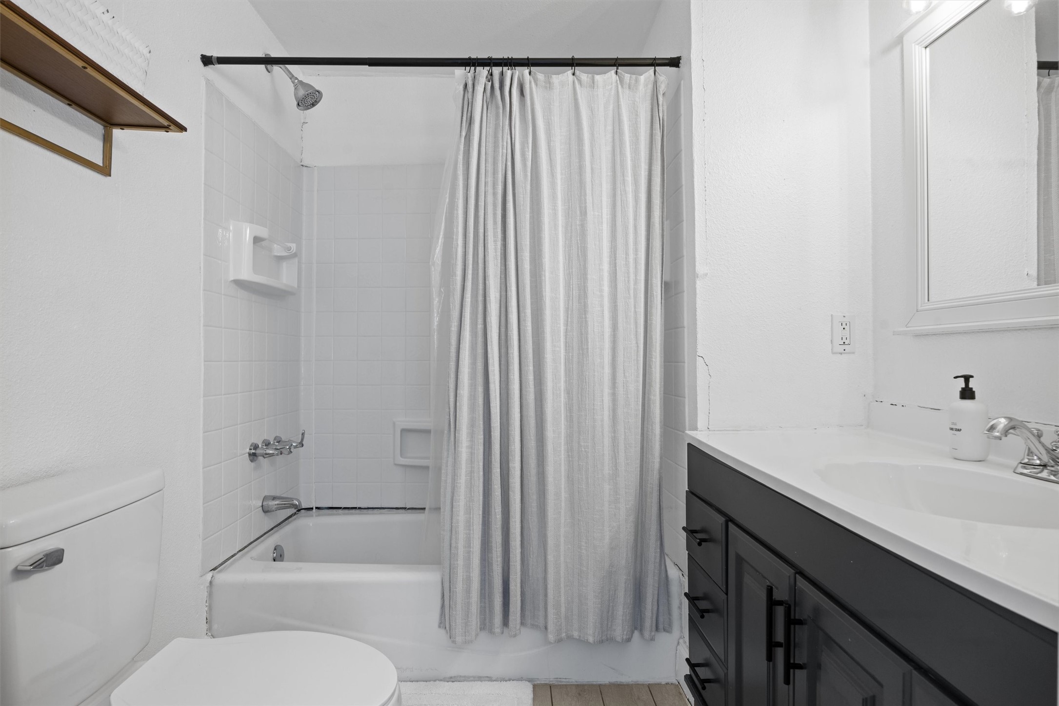 1167 Ridgeway Drive Austin, TX 78702 - Photo 17 of 29 a bathroom with a sink a toilet and shower