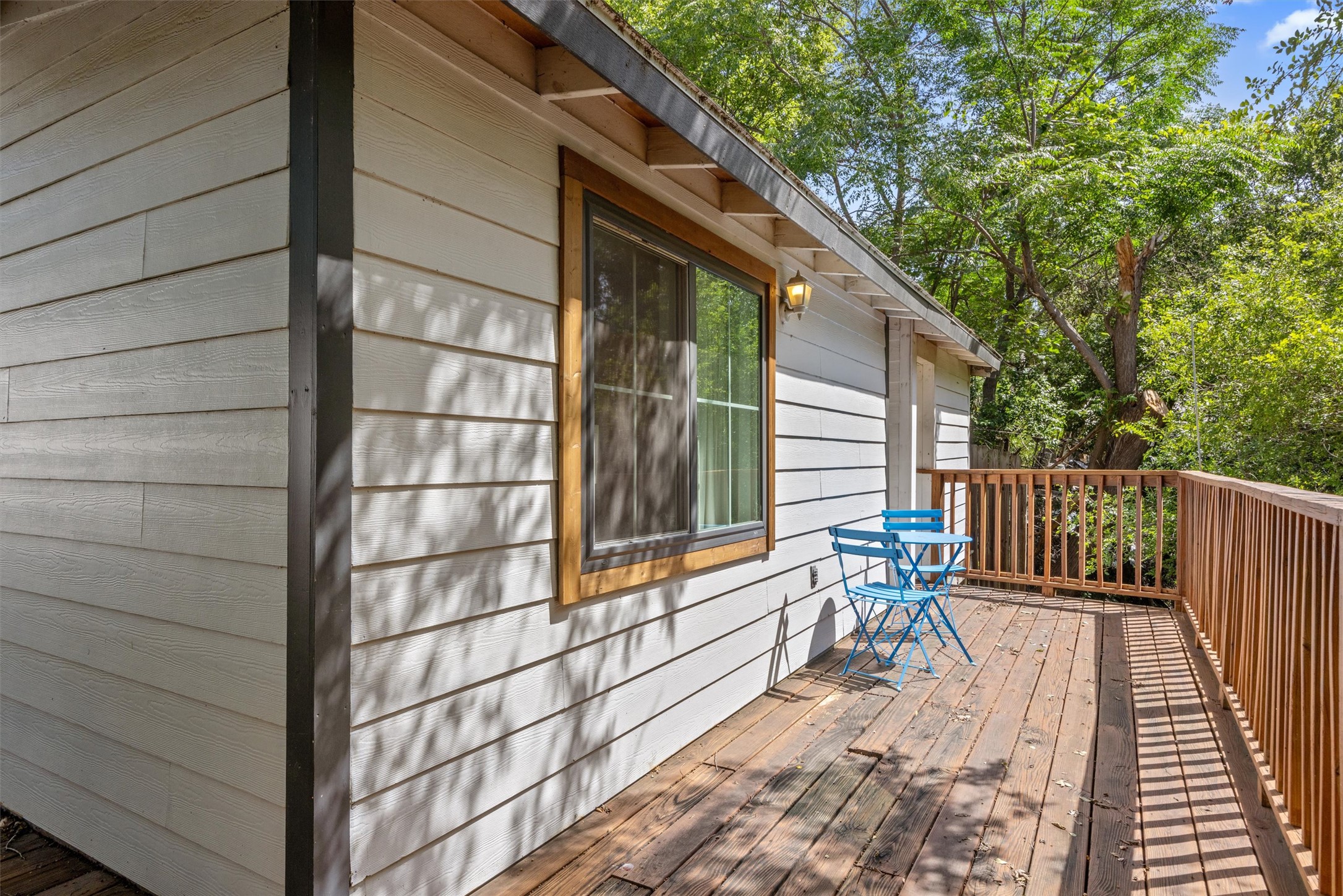 1167 Ridgeway Drive Austin, TX 78702 - Photo 18 of 29 a balcony with chairs and wooden fence