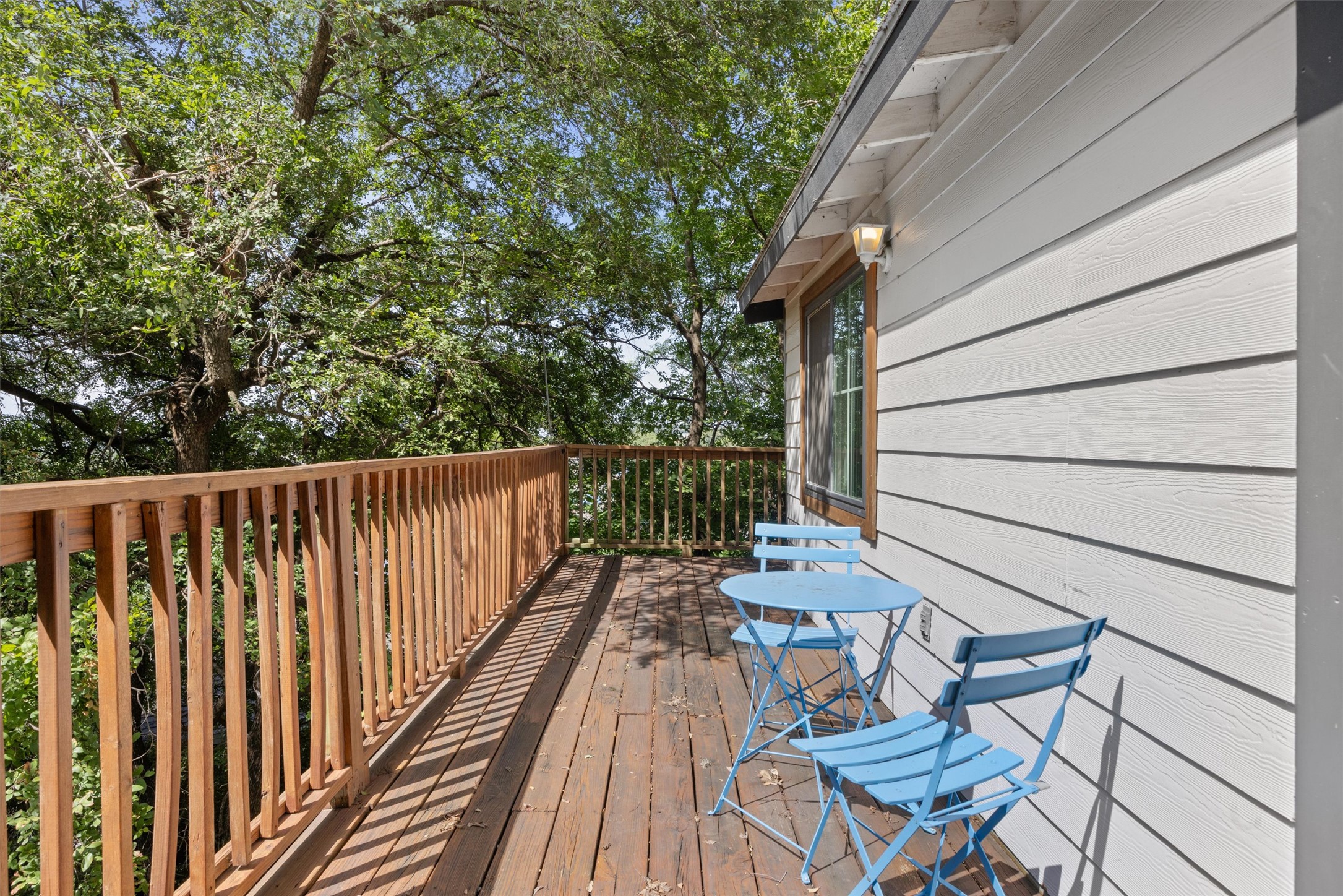 1167 Ridgeway Drive Austin, TX 78702 - Photo 19 of 29 a view of balcony with wooden floor and outdoor seating