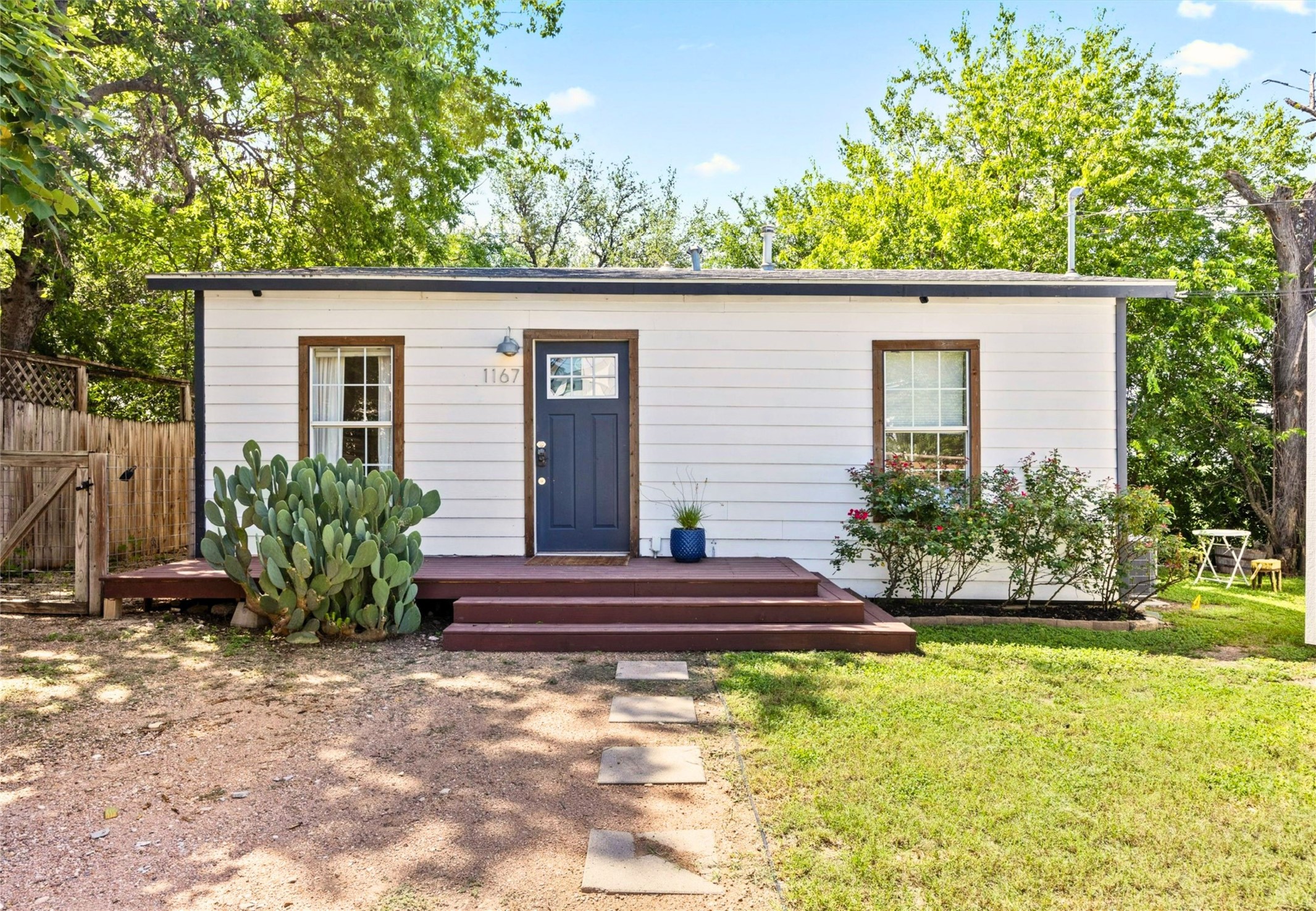 1167 Ridgeway Drive Austin, TX 78702 - Photo 2 of 29 a view of a house with backyard and plants