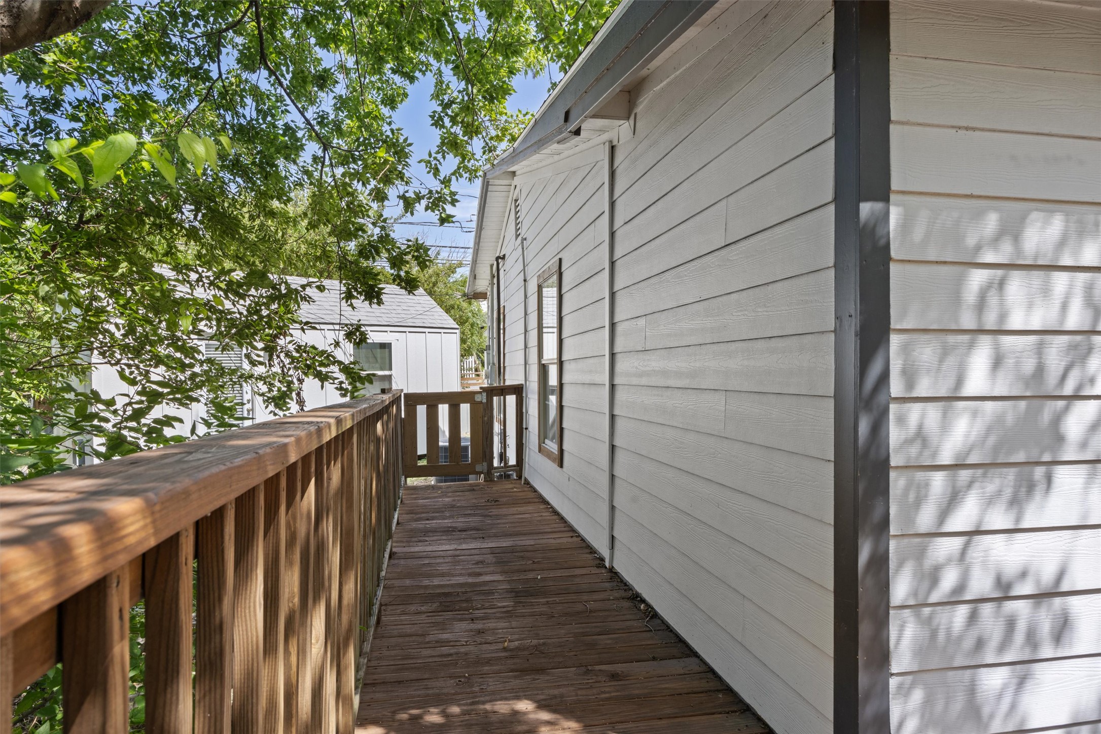 1167 Ridgeway Drive Austin, TX 78702 - Photo 21 of 29 a view of a balcony with wooden floor