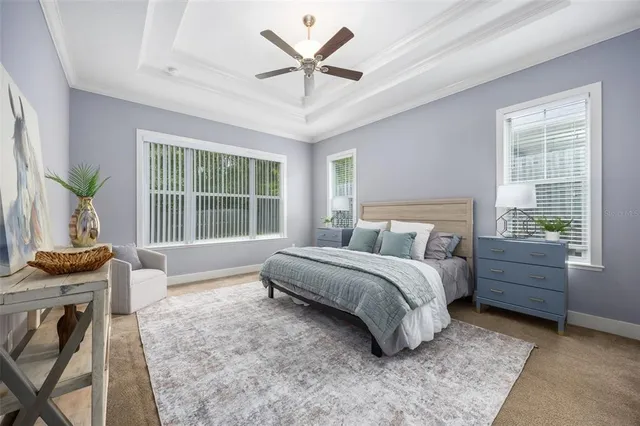 a spacious bedroom with a bed and a table