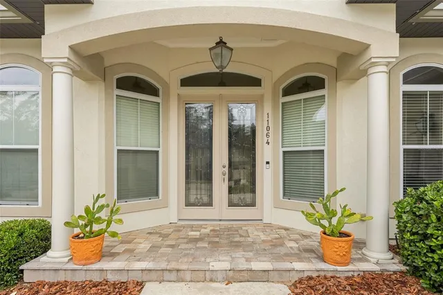 a front view of a house with a garden