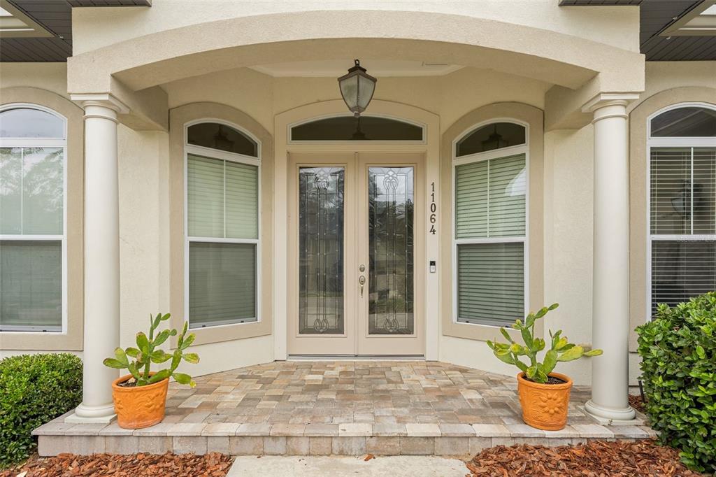 11064 Northwest 18th Road Gainesville, FL 32606 - Photo 2 of 30 a front view of a house with a garden
