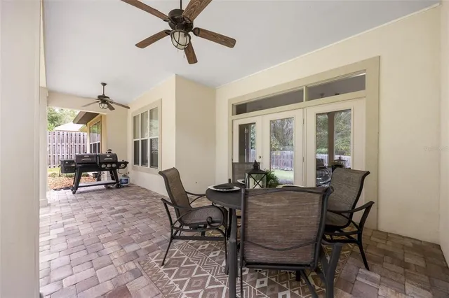 a dining room with furniture and a window