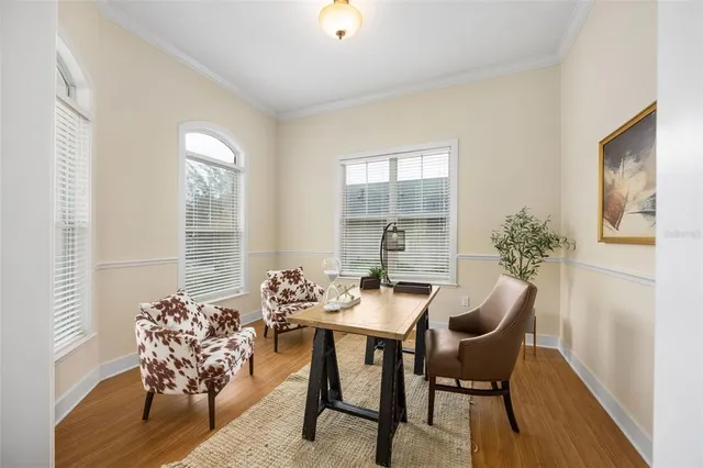 a dining room with furniture and window