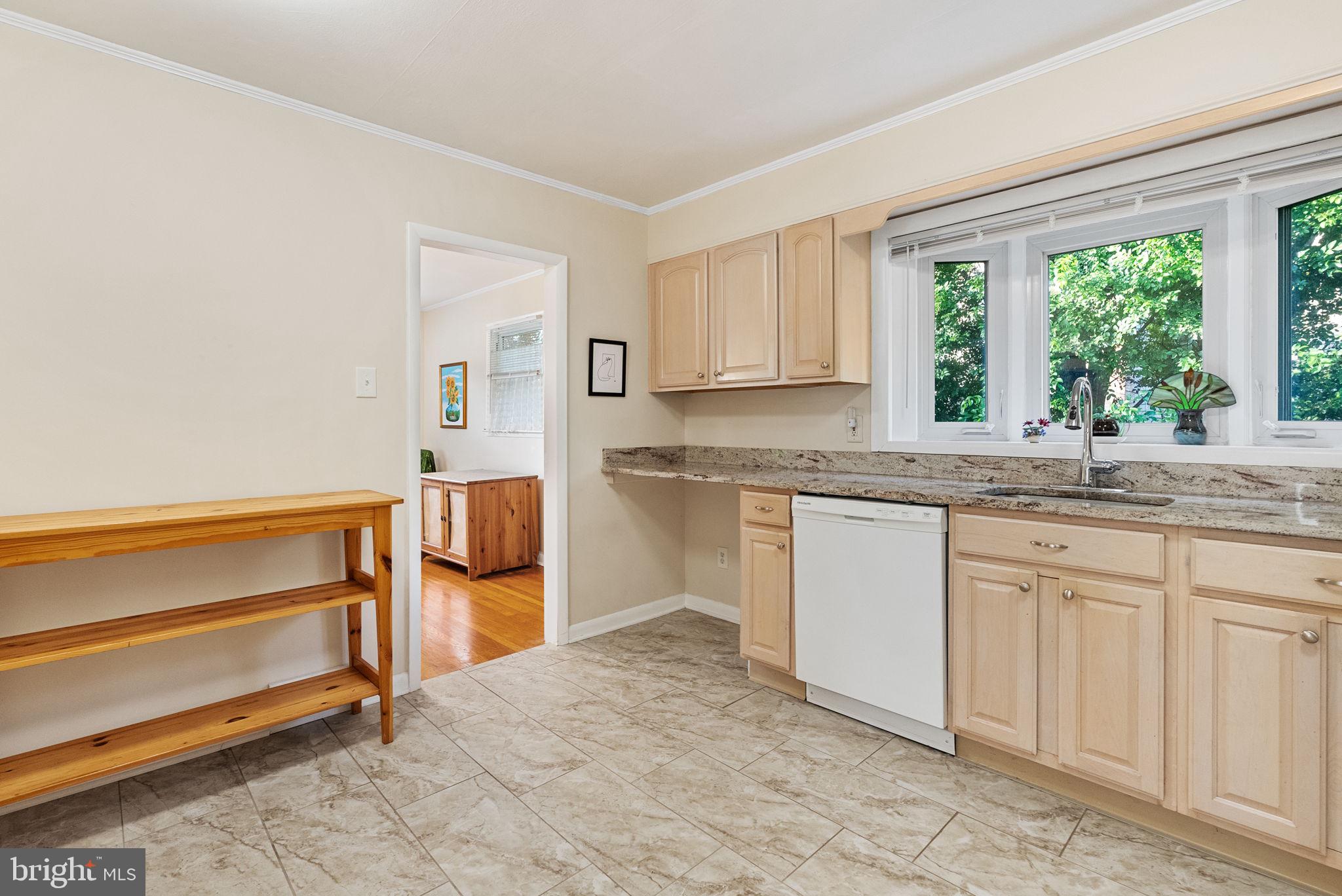 391 Rittenhouse Boulevard Eagleville, PA 19403 - Photo 14 of 43 a kitchen with granite countertop white cabinets and white appliances