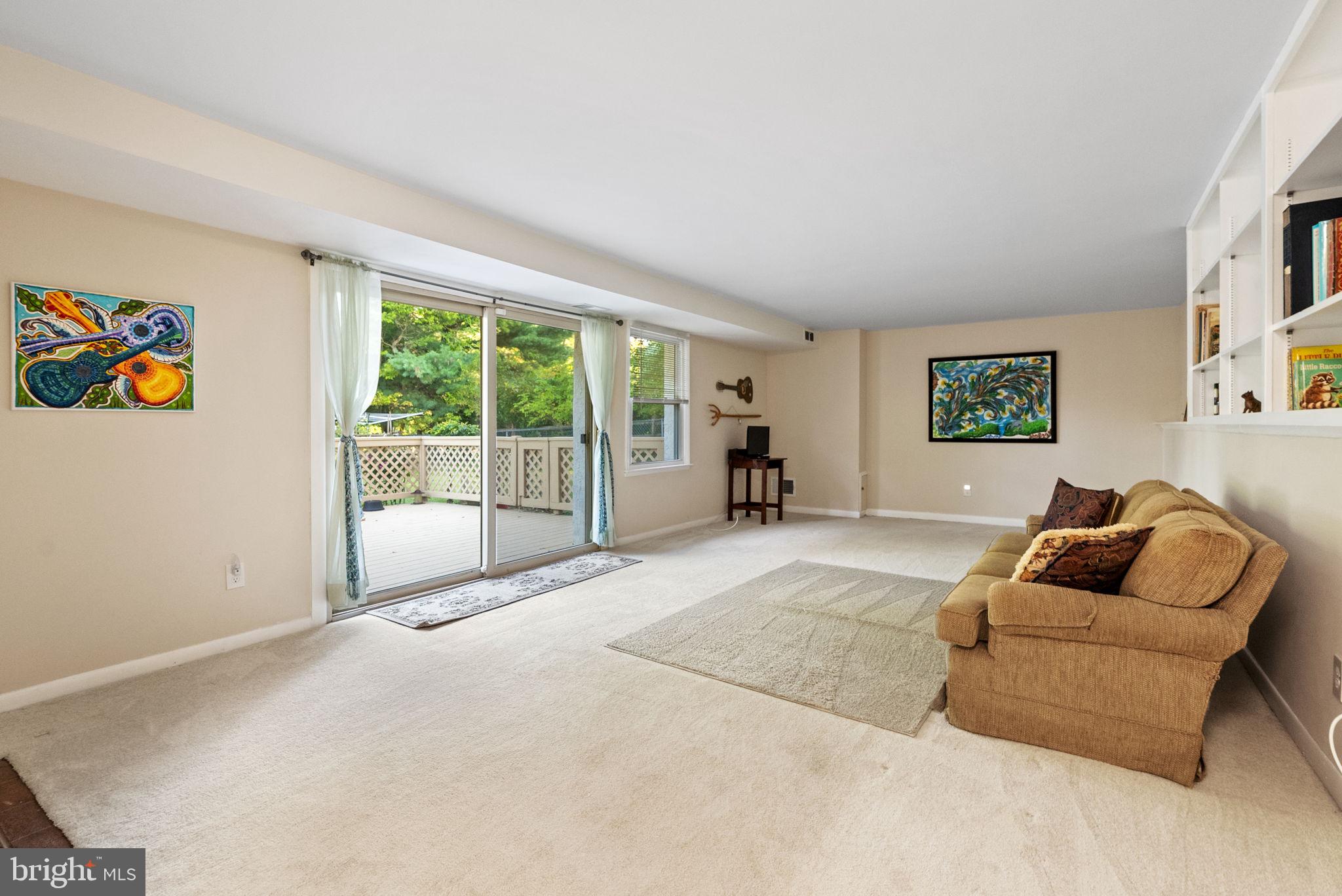 391 Rittenhouse Boulevard Eagleville, PA 19403 - Photo 15 of 43 a living room with furniture and a large window
