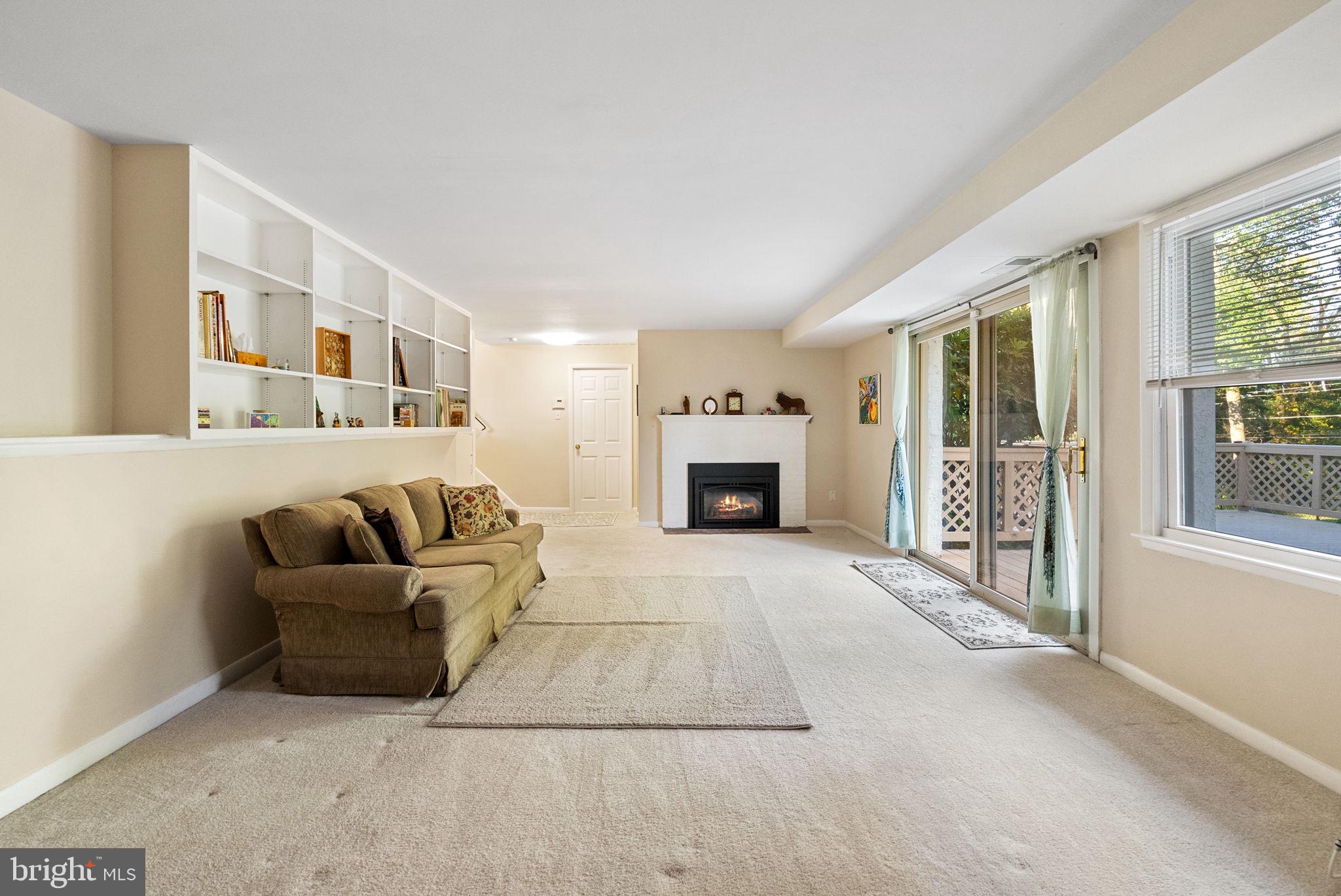 391 Rittenhouse Boulevard Eagleville, PA 19403 - Photo 16 of 43 a living room with furniture and a fireplace