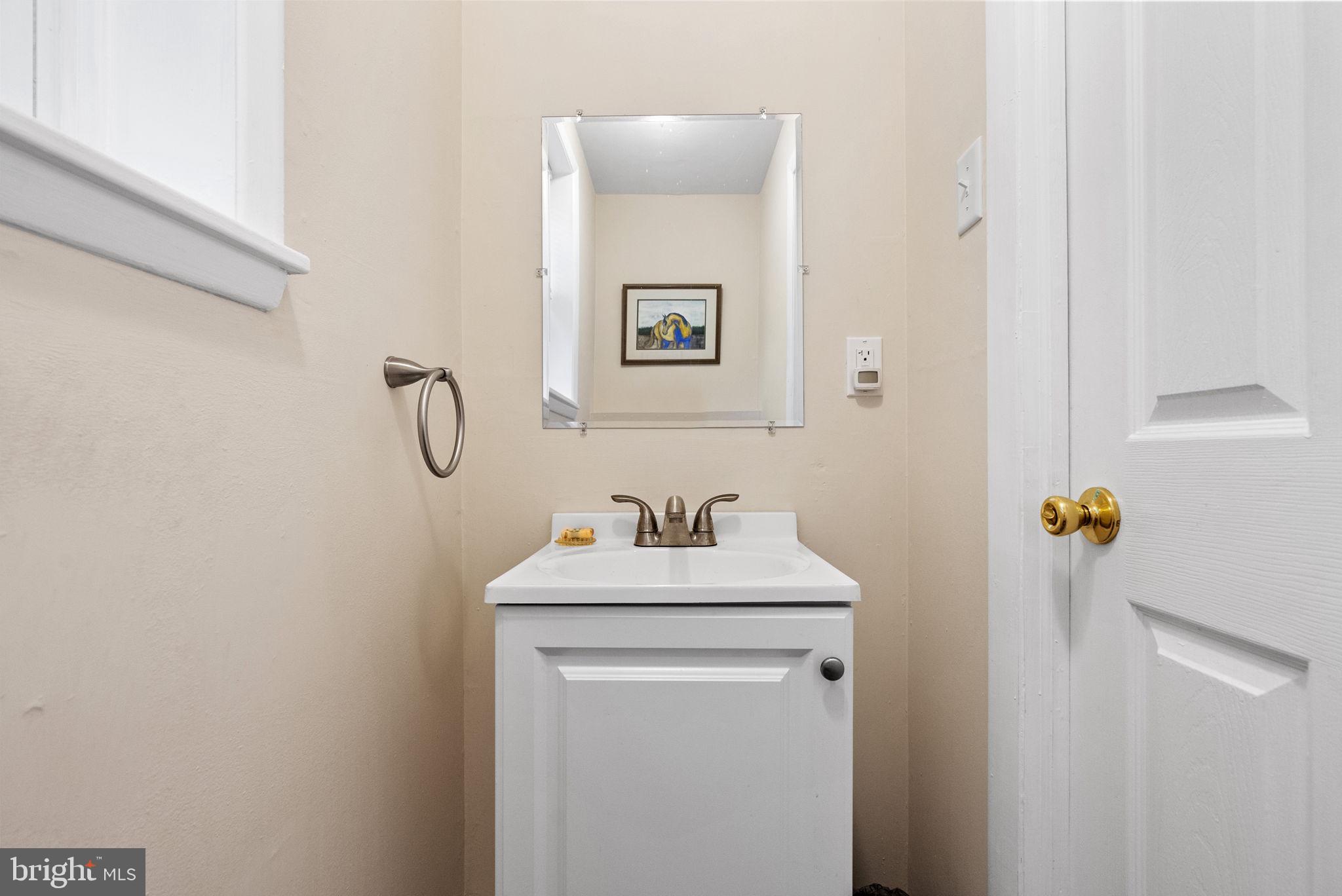 391 Rittenhouse Boulevard Eagleville, PA 19403 - Photo 19 of 43 a bathroom with a sink mirror and toilet