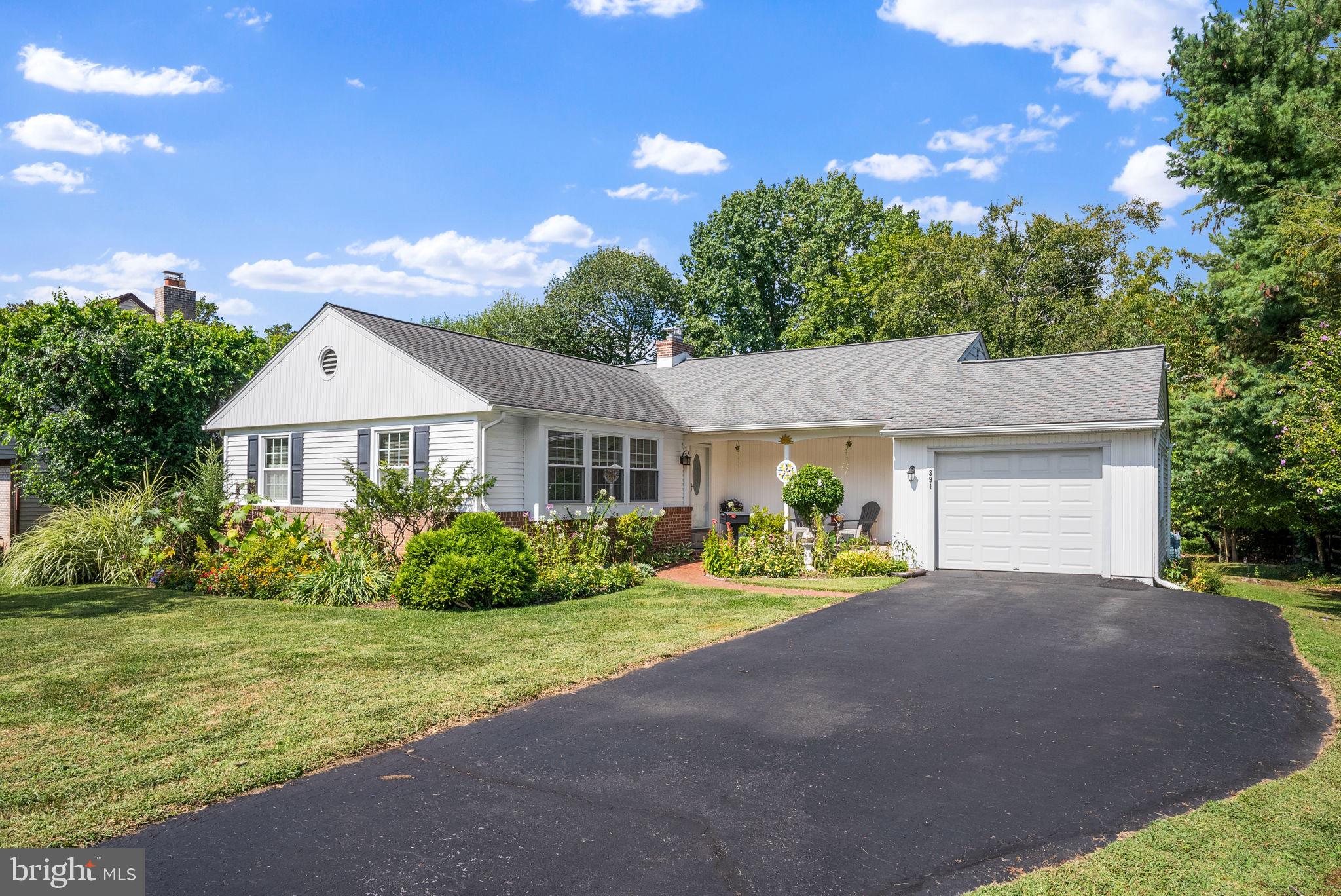391 Rittenhouse Boulevard Eagleville, PA 19403 - Photo 2 of 43 a front view of a house with garden