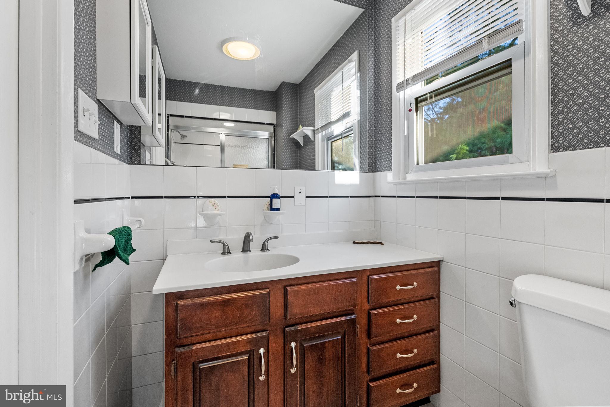 391 Rittenhouse Boulevard Eagleville, PA 19403 - Photo 22 of 43 a bathroom with a sink and a mirror