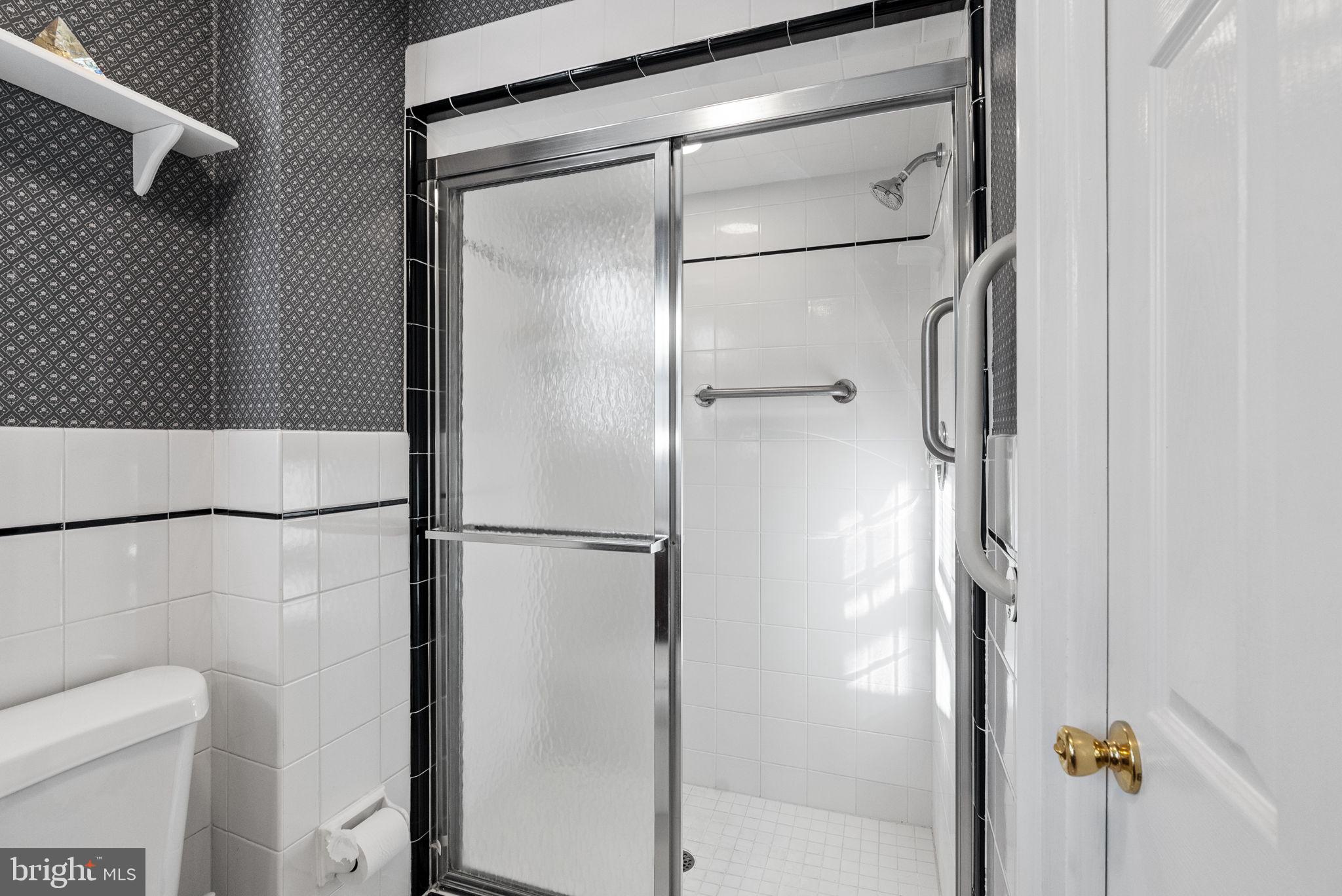 391 Rittenhouse Boulevard Eagleville, PA 19403 - Photo 23 of 43 a bathroom with a glass shower door