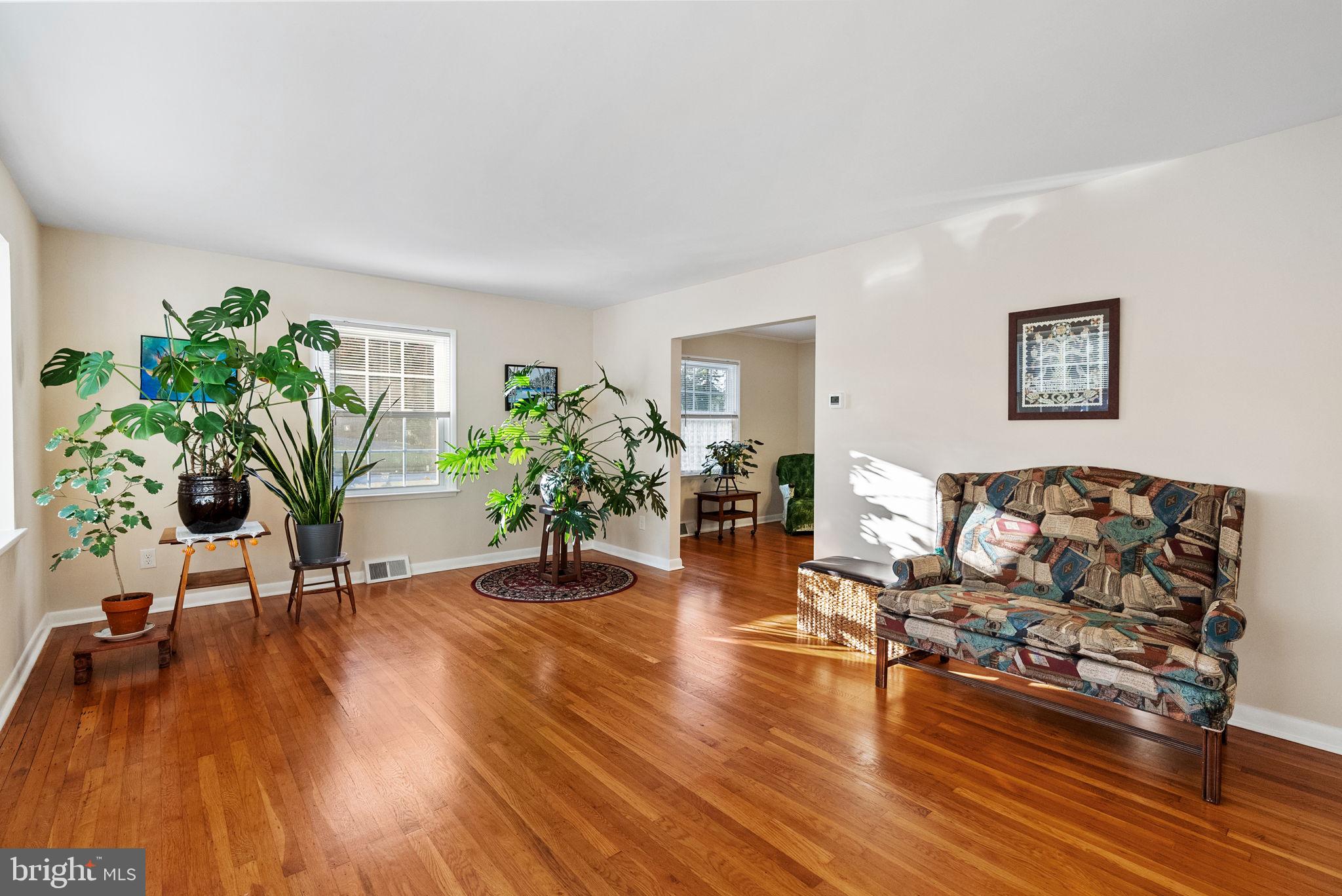 391 Rittenhouse Boulevard Eagleville, PA 19403 - Photo 6 of 43 a living room with furniture and a wooden floor