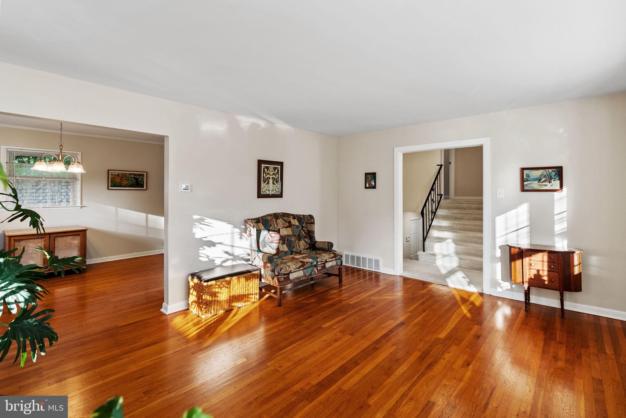391 Rittenhouse Boulevard Eagleville, PA 19403 - Photo 7 of 43 a living room with furniture and a wooden floor