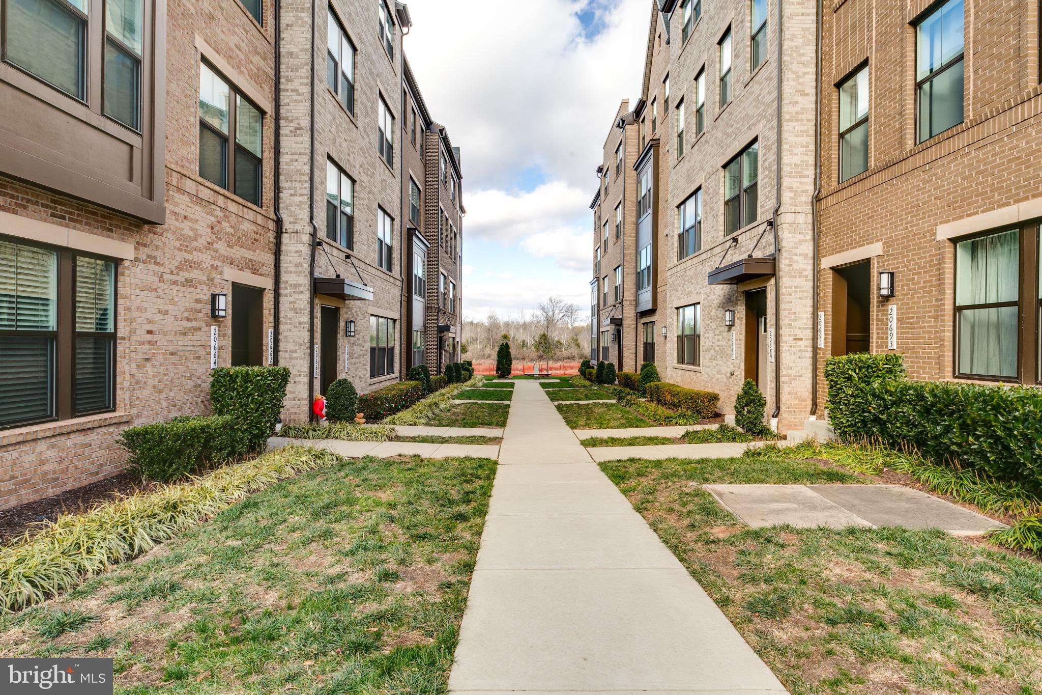 20687 Heron Landing Drive Sterling, VA 20166 - Photo 1 of 39 Charming pathway between modern residences.