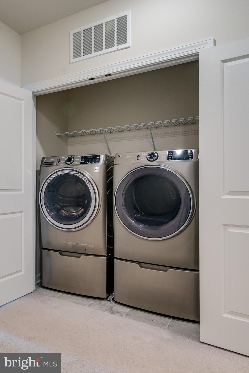 20687 Heron Landing Drive Sterling, VA 20166 - Photo 21 of 39 Sleek laundry space with modern appliances.