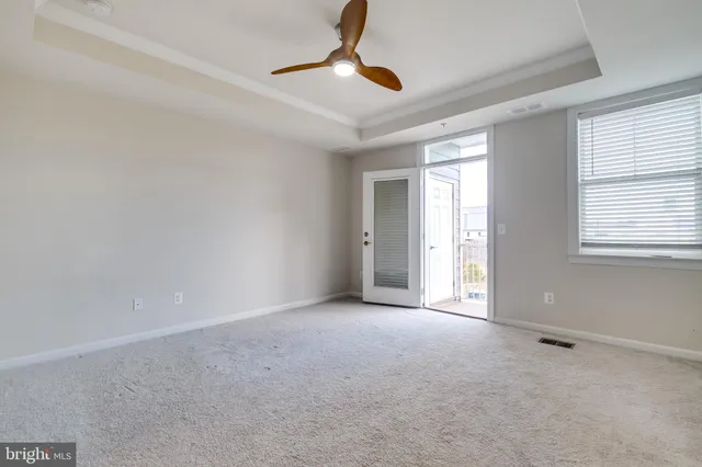 a view of an empty room with windows