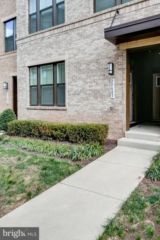 a view of a brick house with a large window