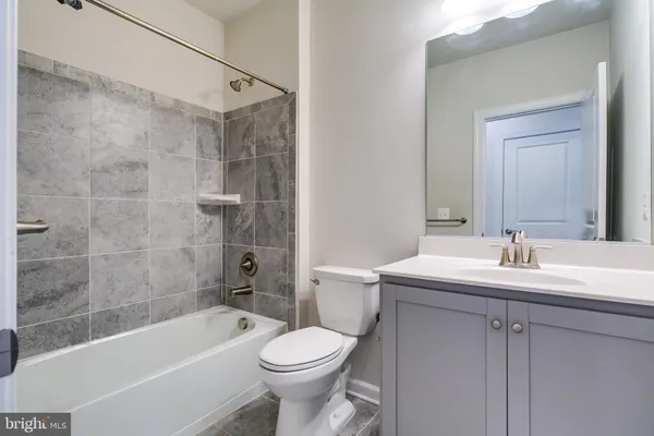 a front view of a building with a garden