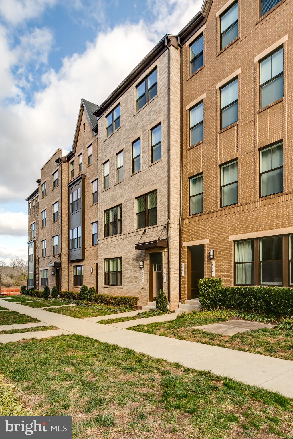 20687 Heron Landing Drive Sterling, VA 20166 - Photo 37 of 39 Modern townhomes with inviting pathways.