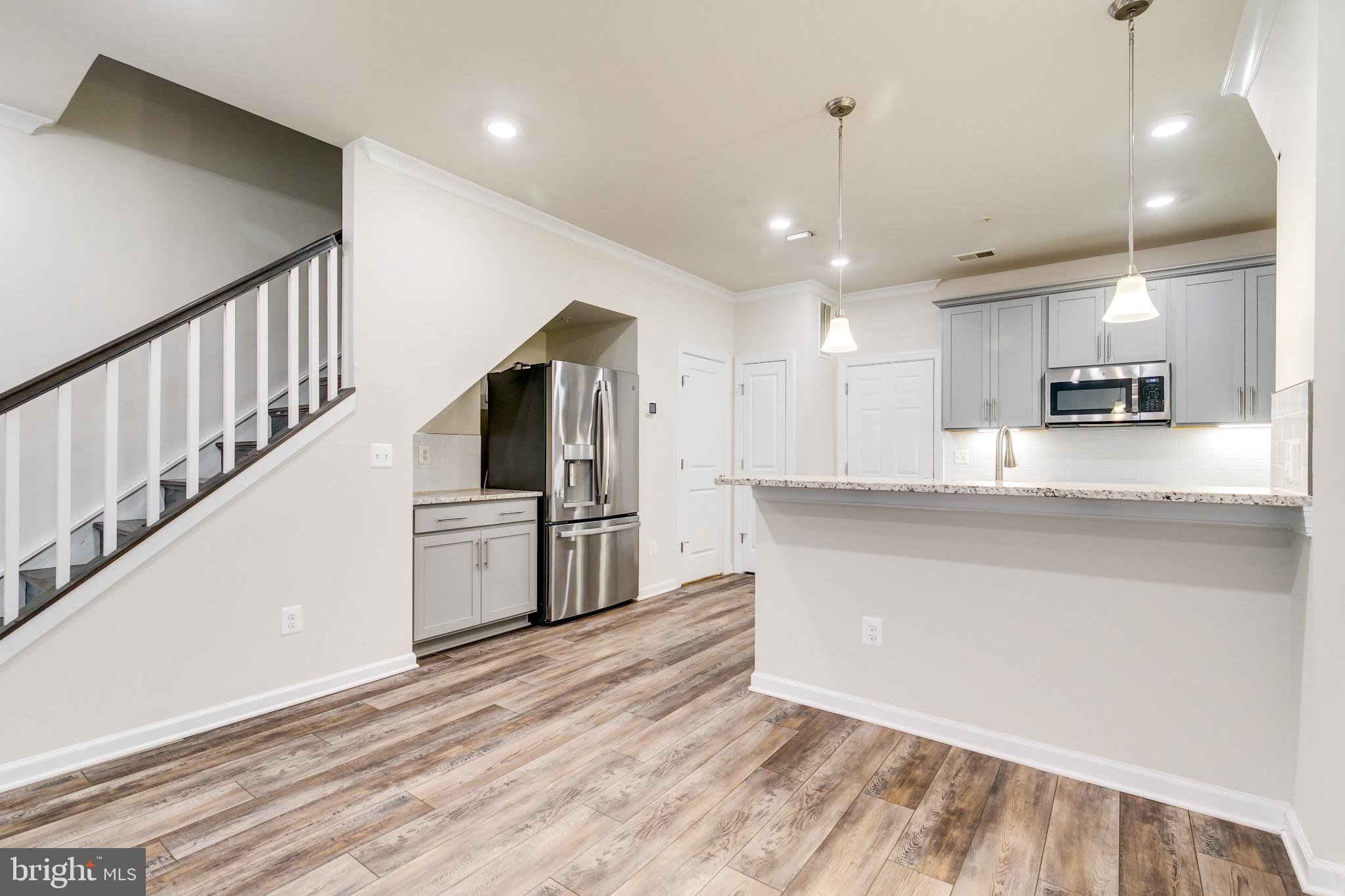 20687 Heron Landing Drive Sterling, VA 20166 - Photo 9 of 39 Modern kitchen with open layout charm.