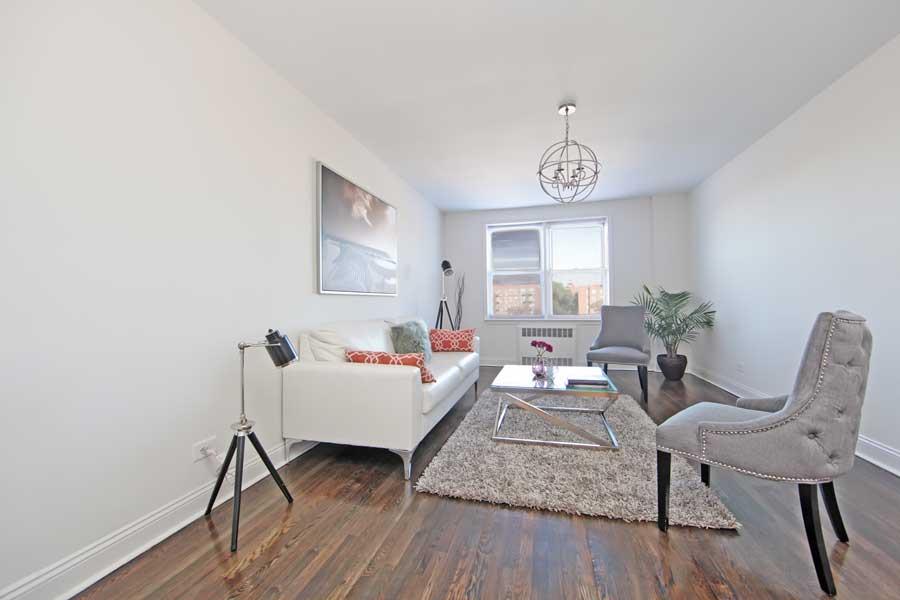 36 Dahill Road, Unit 5J Brooklyn, NY 11218 - Photo 1 of 1 a living room with furniture and wooden floor