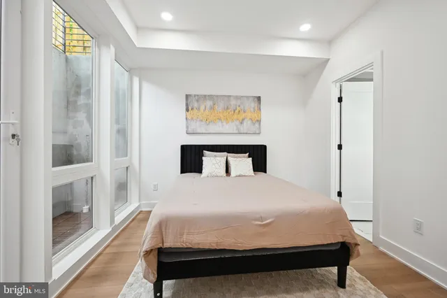 a large white bed in a white room