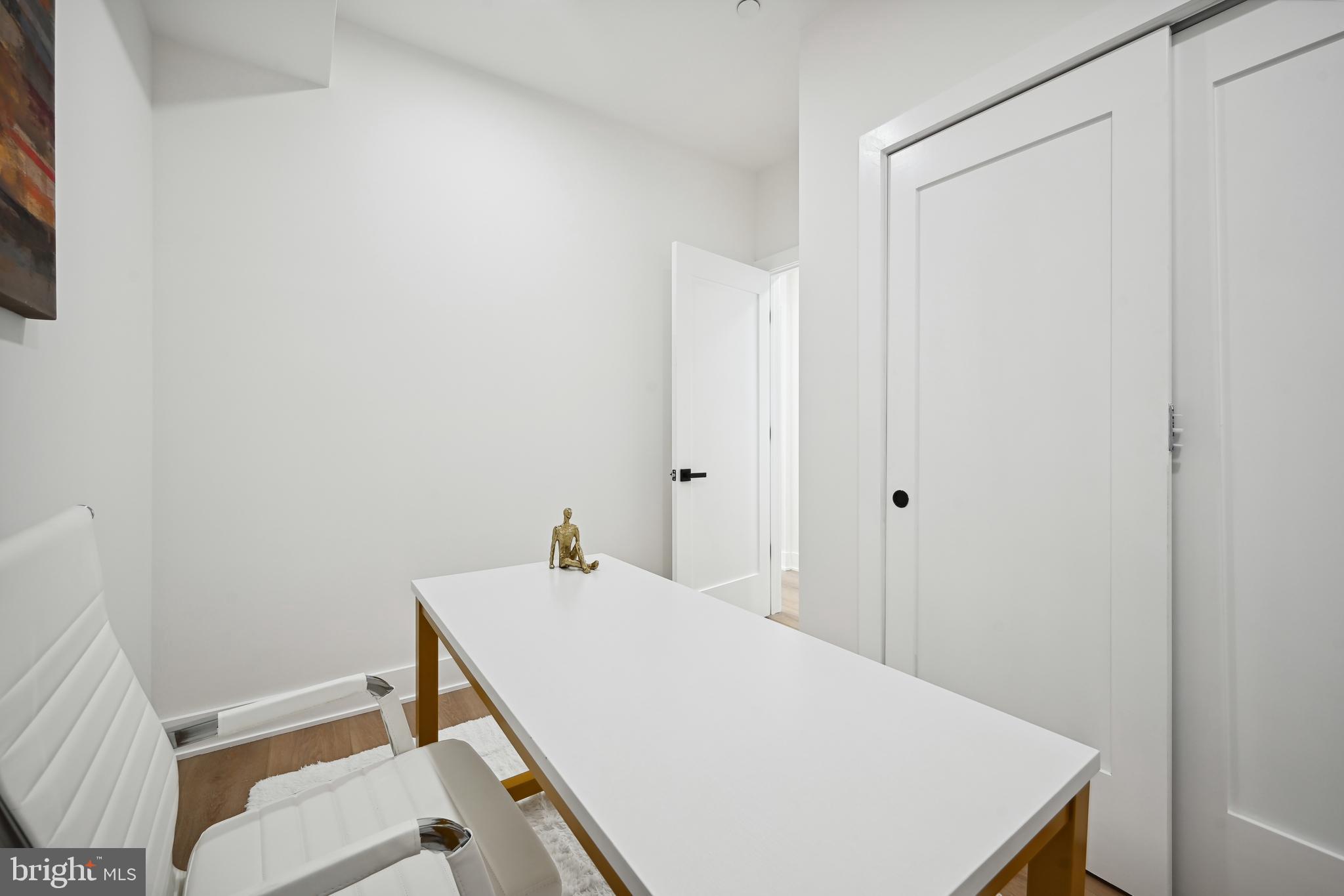 1372 Bryant Street Northeast, Unit 2A Washington, DC 20018 - Photo 16 of 22 a room with a table and chairs