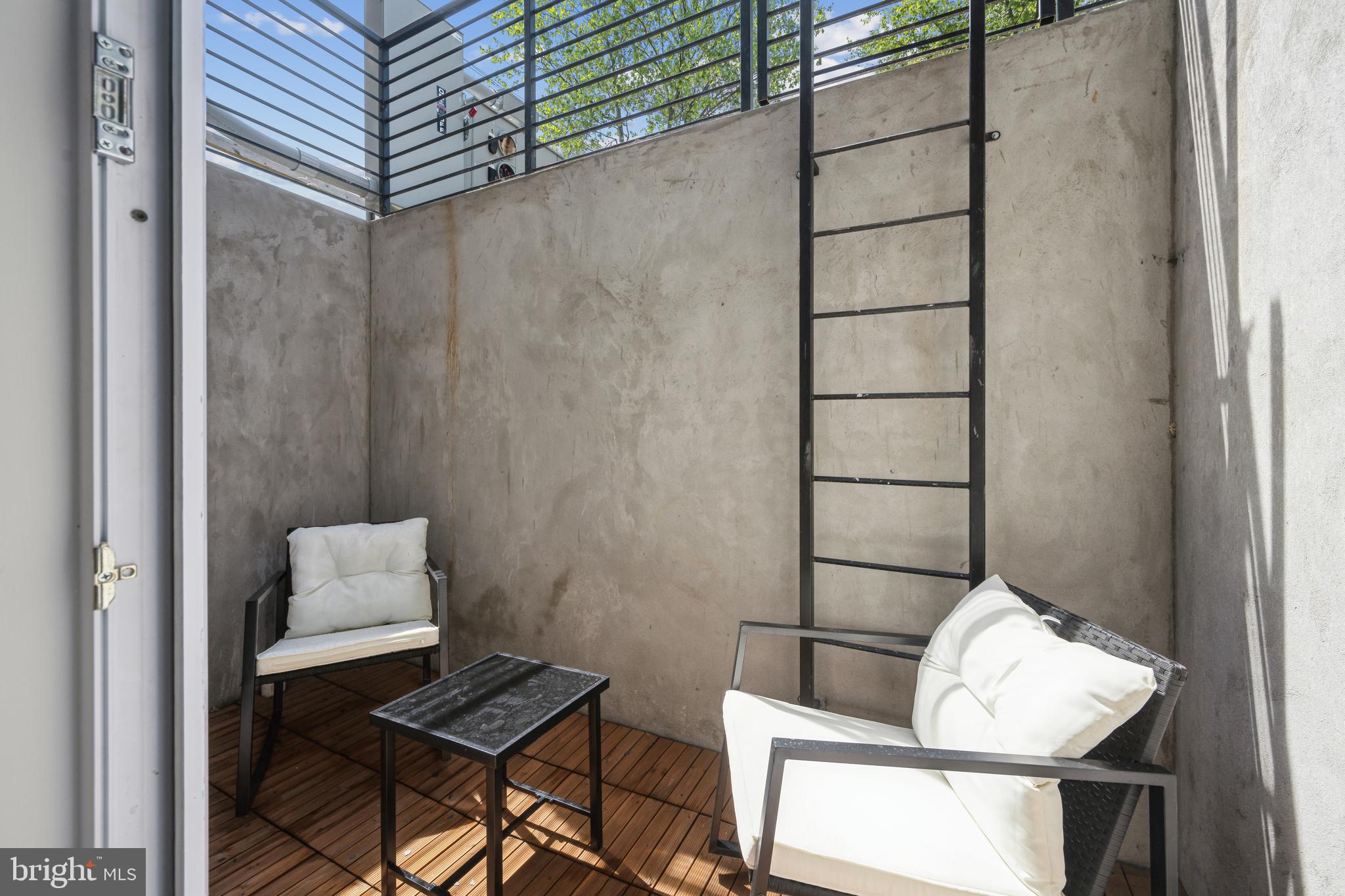 1372 Bryant Street Northeast, Unit 2A Washington, DC 20018 - Photo 19 of 22 a room with a table and a chair
