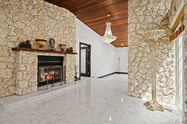 a kitchen with stainless steel appliances granite countertop a refrigerator a sink and a stove