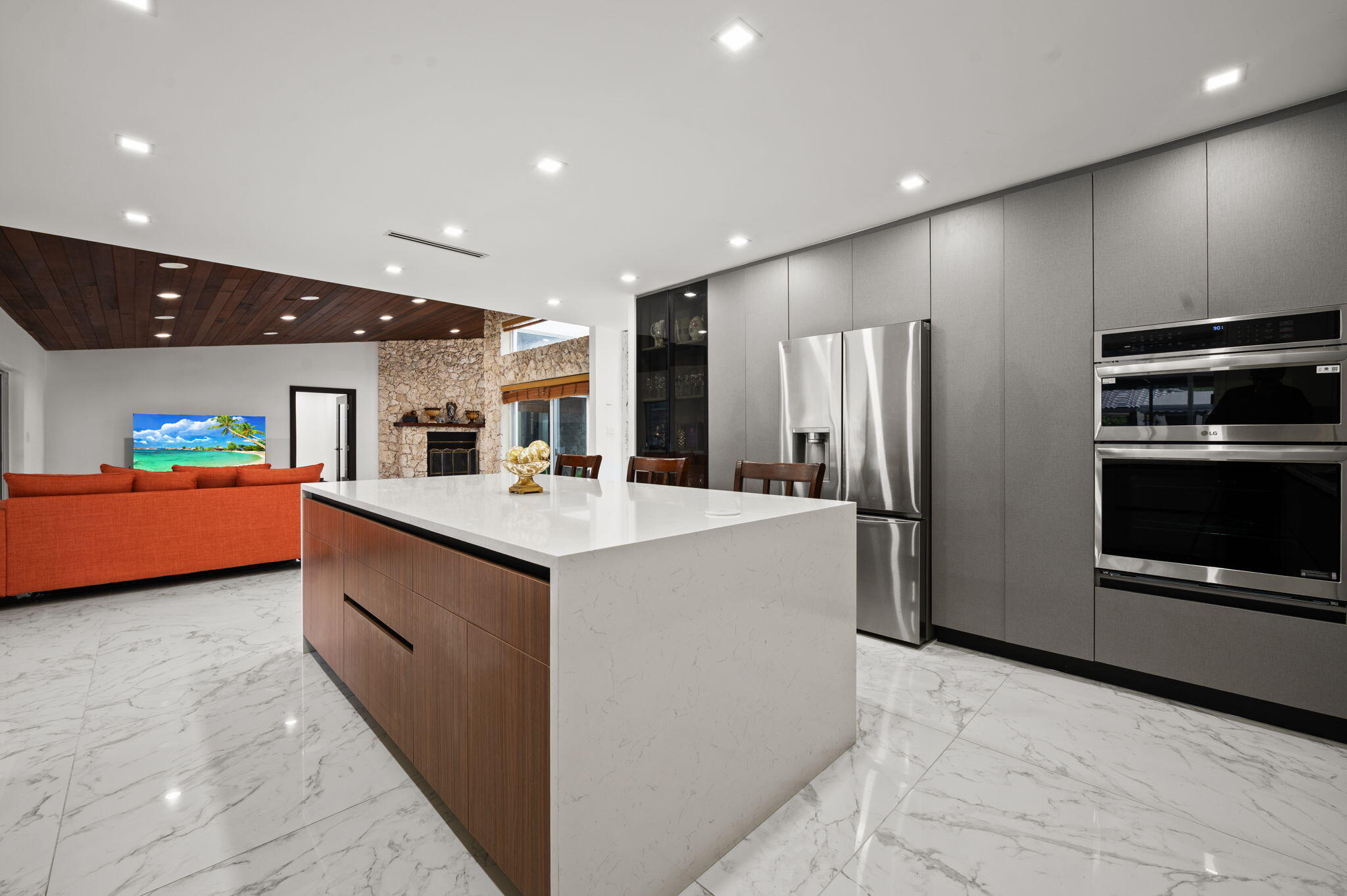 2840 Southwest 128th Avenue Miami, FL 33175 - Photo 15 of 46 a kitchen with stainless steel appliances kitchen island granite countertop a refrigerator and a stove