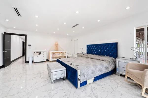 a white bath tub sitting next to a white toilet