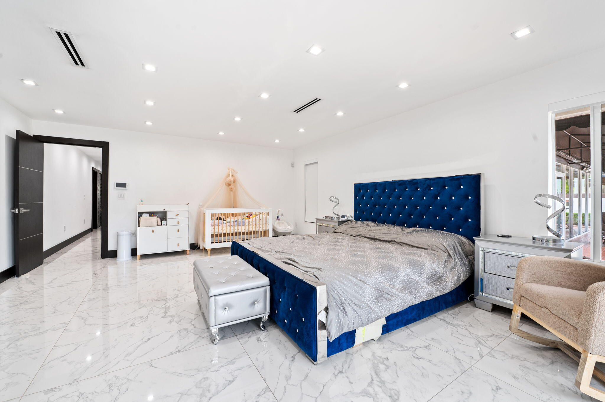 2840 Southwest 128th Avenue Miami, FL 33175 - Photo 18 of 46 a spacious bedroom with a bed and a couch