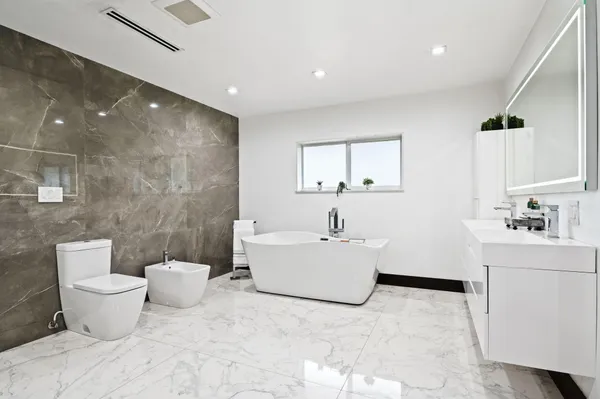a bathroom with a shower and a sink