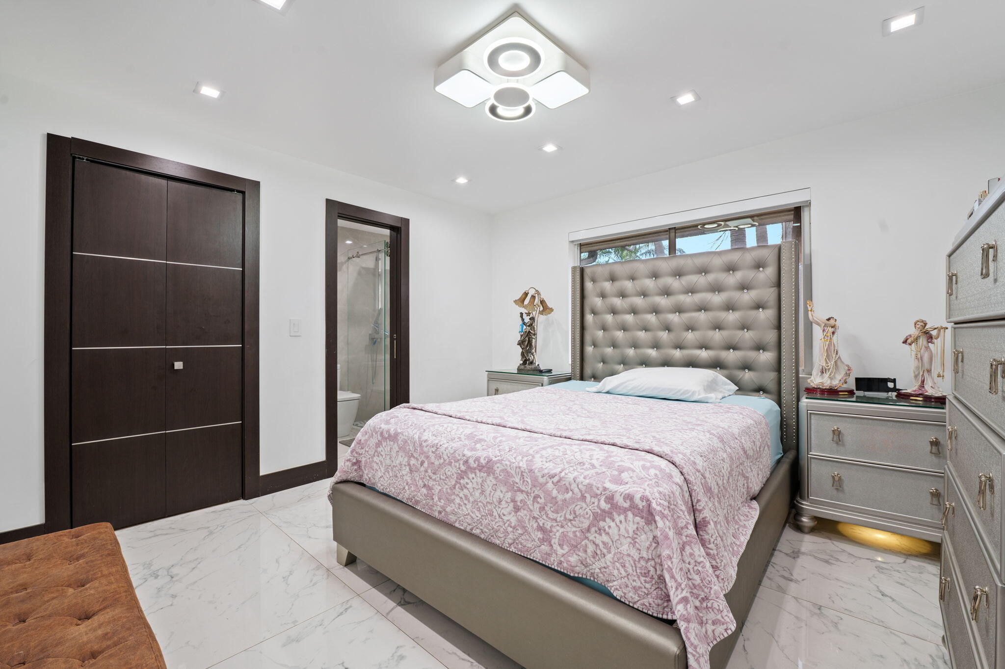 2840 Southwest 128th Avenue Miami, FL 33175 - Photo 22 of 46 a bedroom with a bed and a chandelier