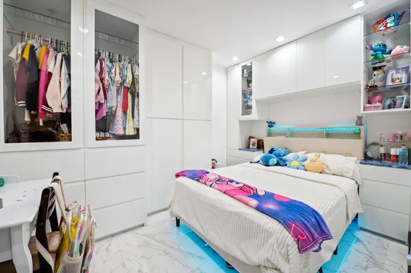 a view of a kitchen with a sink and refrigerator