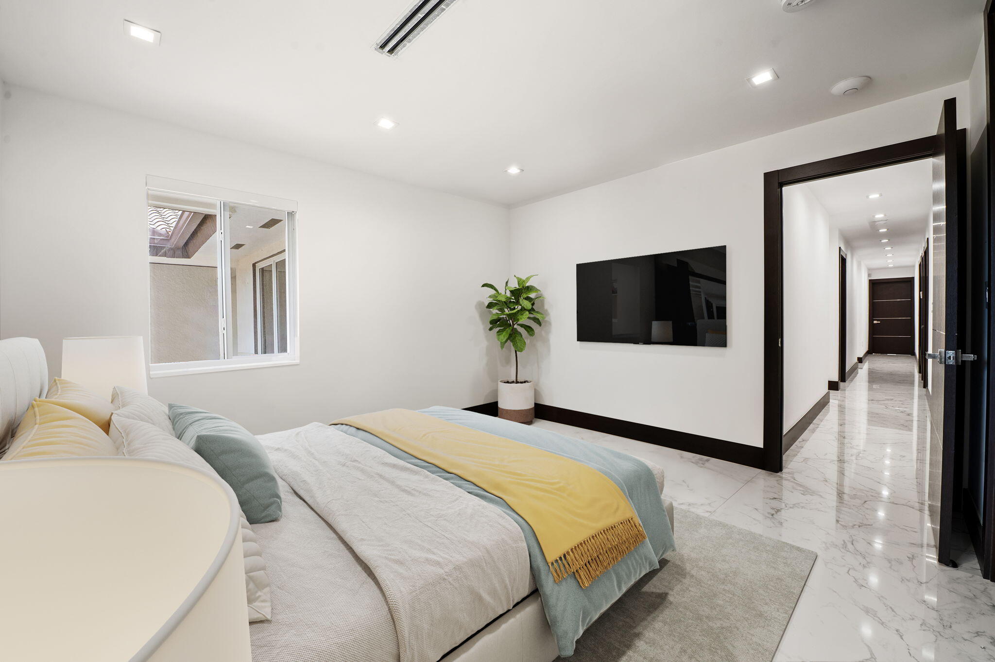 2840 Southwest 128th Avenue Miami, FL 33175 - Photo 29 of 46 a bedroom with a large white bed and a flat screen tv
