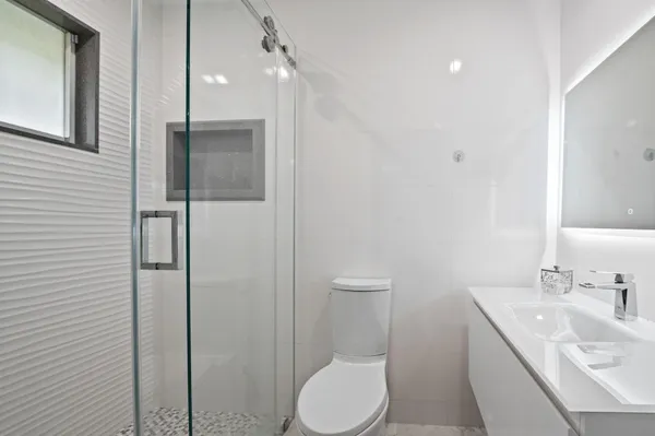 a view of a patio with table and chairs potted plants with wooden floor