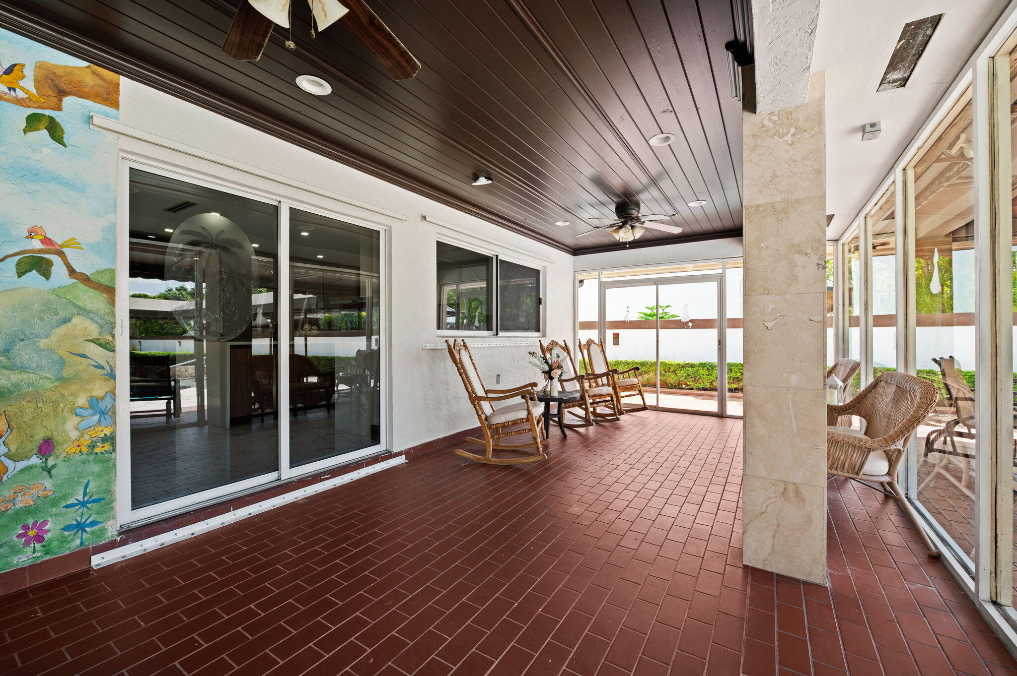 2840 Southwest 128th Avenue Miami, FL 33175 - Photo 31 of 46 a view of a patio with table and chairs potted plants with wooden floor