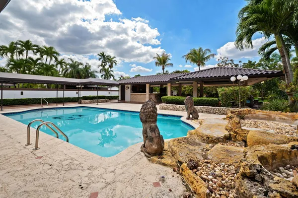 a view of a swimming pool with a patio