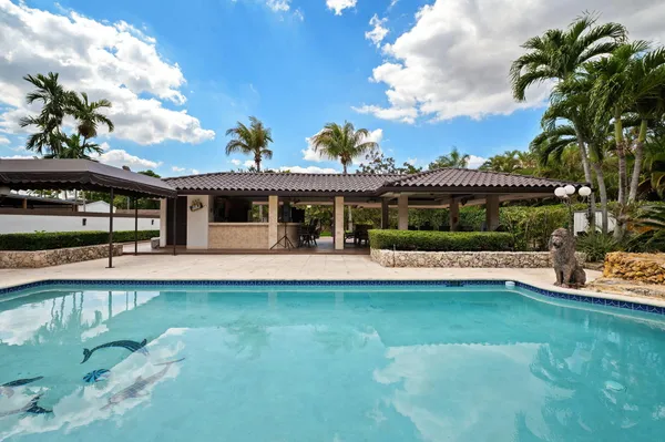 a view of a house with a swimming pool