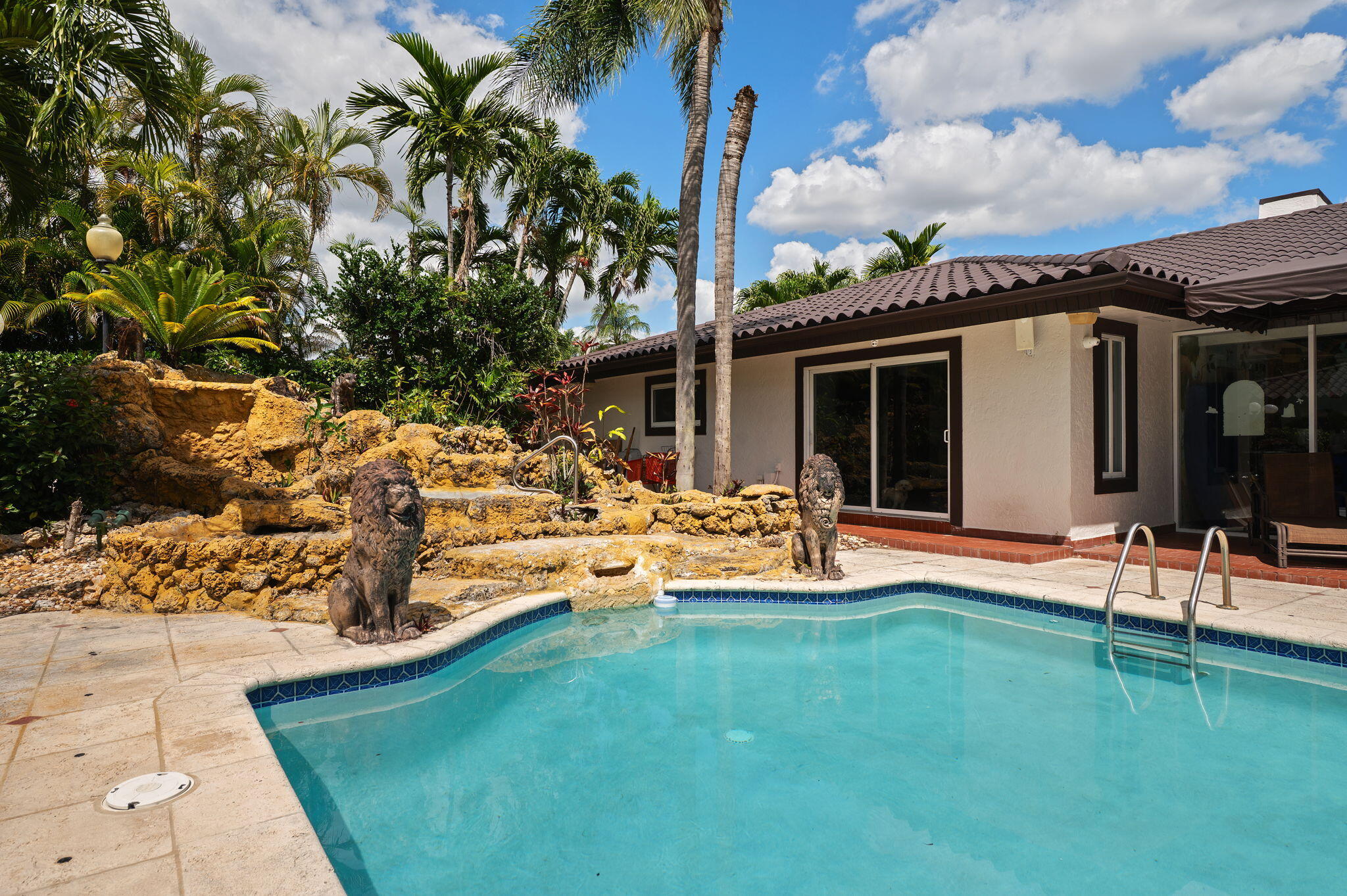 2840 Southwest 128th Avenue Miami, FL 33175 - Photo 37 of 46 a view of a house with swimming pool and porch with furniture