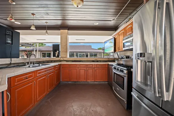 a view of a chairs and table in the patio