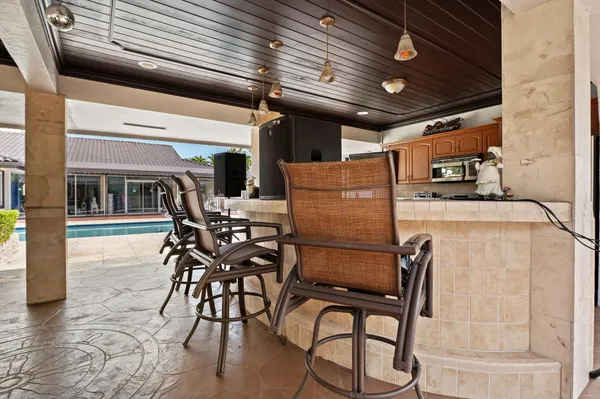 a view of a house with sitting area and a yard