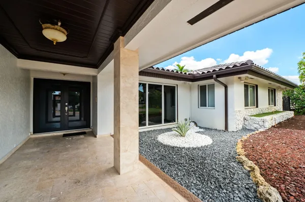 a view of a house with a small yard