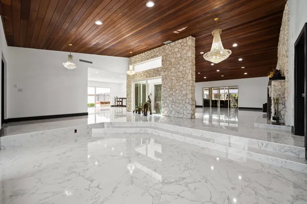 a view of a hallway with seating space