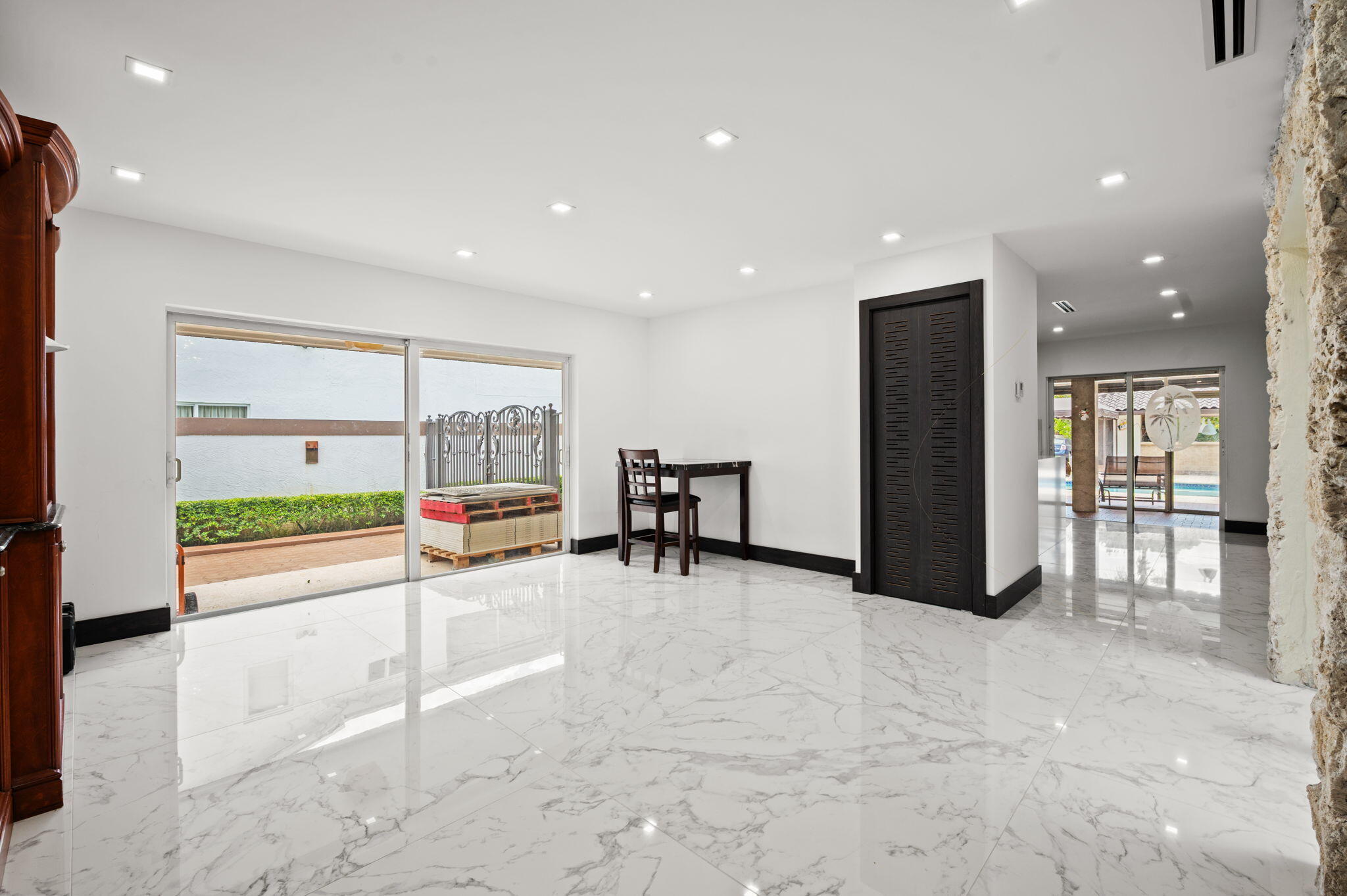 2840 Southwest 128th Avenue Miami, FL 33175 - Photo 9 of 46 a view of a room with gym equipment and large windows